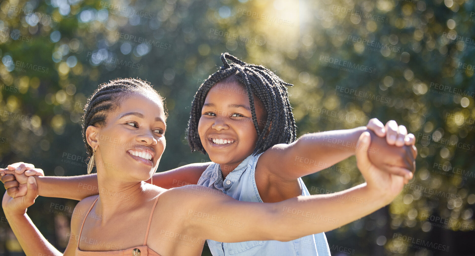 Buy stock photo African mother, child and happy girl at park for love, bonding together and holding hands for support. Mom, kid and parent smile in nature for connection, care or family play airplane game in summer