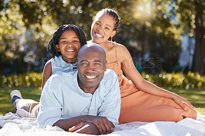 Buy stock photo Portrait, happy and African family on picnic, outdoor and together in park for fun, bonding and smile in nature. Summer, mom and dad with daughter on grass, black man and woman in forest and love