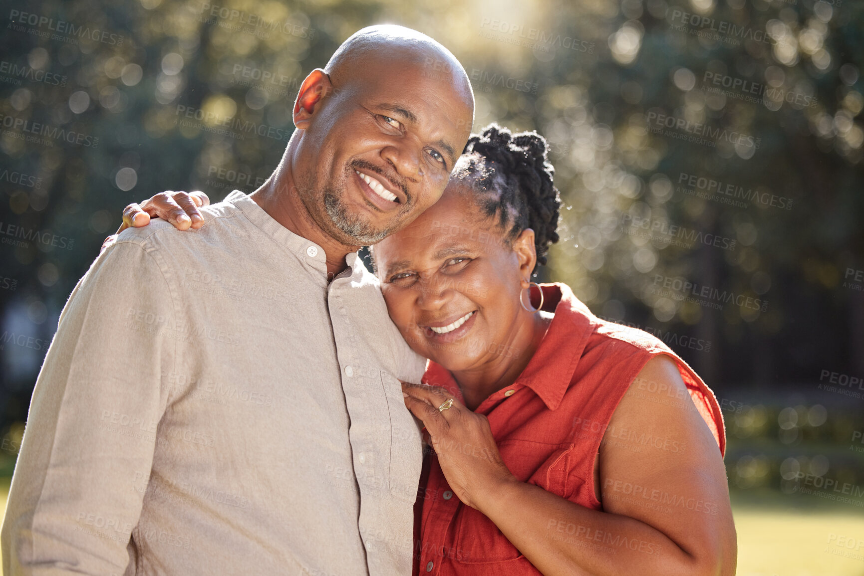 Buy stock photo Senior couple, black people and portrait in park with hug for bonding, love and commitment in marriage. Mature, man and woman with smile, embrace and romance outdoor in nature for holiday and support