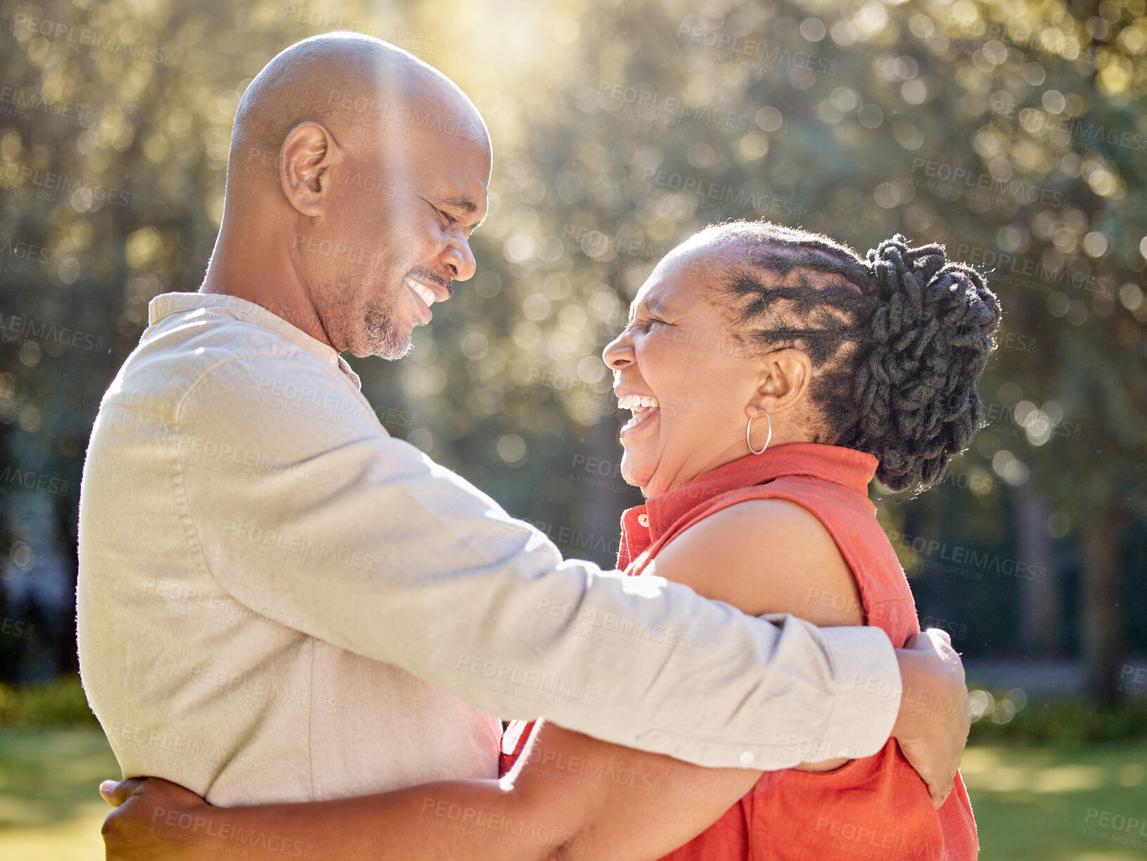 Buy stock photo Senior couple, black people and laughing in park with hug for bonding, love and commitment in marriage. Mature, man and woman with joke, embrace and romance outdoor in nature for holiday and support