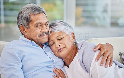 Buy stock photo Hug, love and security with senior couple on sofa of home living room together for bonding. Marriage, relax or wellness with elderly man and woman in apartment for relationship, retirement or romance