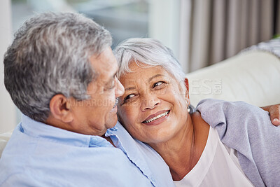 Buy stock photo Hug, love and wellness with senior couple on sofa of home living room together for bonding. Marriage, relax or security with elderly man and woman in apartment for relationship, retirement or romance