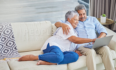 Buy stock photo Senior couple, relax and sofa with laptop for entertainment, online browsing or bonding together at home. Mature man and woman with smile or pointing on computer or couch for web or search at house