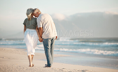 Buy stock photo Old couple, holding hands and walking on beach for love, travel and sea waves for retirement. Senior people, marriage and holiday for date by water, back and tropical island for weekend vacation