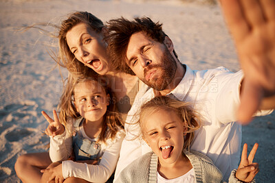 Buy stock photo Parents, kids and selfie at beach, funny face or smile with care, love or tongue out for memory in summer. Father, mother and daughter children with peace sign, family or portrait on holiday in Spain