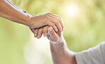 Closeup of an unrecognizable doctor offering their patient support during recovery. A loving unknown doctor holding the hand of her patient and showing kindness while doing a checkup at home