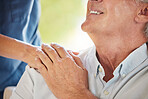 Closeup of an unrecognizable doctor offering their patient support during recovery. A loving unknown doctor holding the hand of her patient and showing kindness while doing a checkup at home