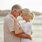 Closeup of a happy senior caucasian couple standing and embracing each ...