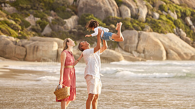 Buy stock photo Lifting, happy child and parents on beach as family for love, support and care on vacation or holiday. Woman, male person and bonding with kid, play and fun in outdoor in together, affection or relax