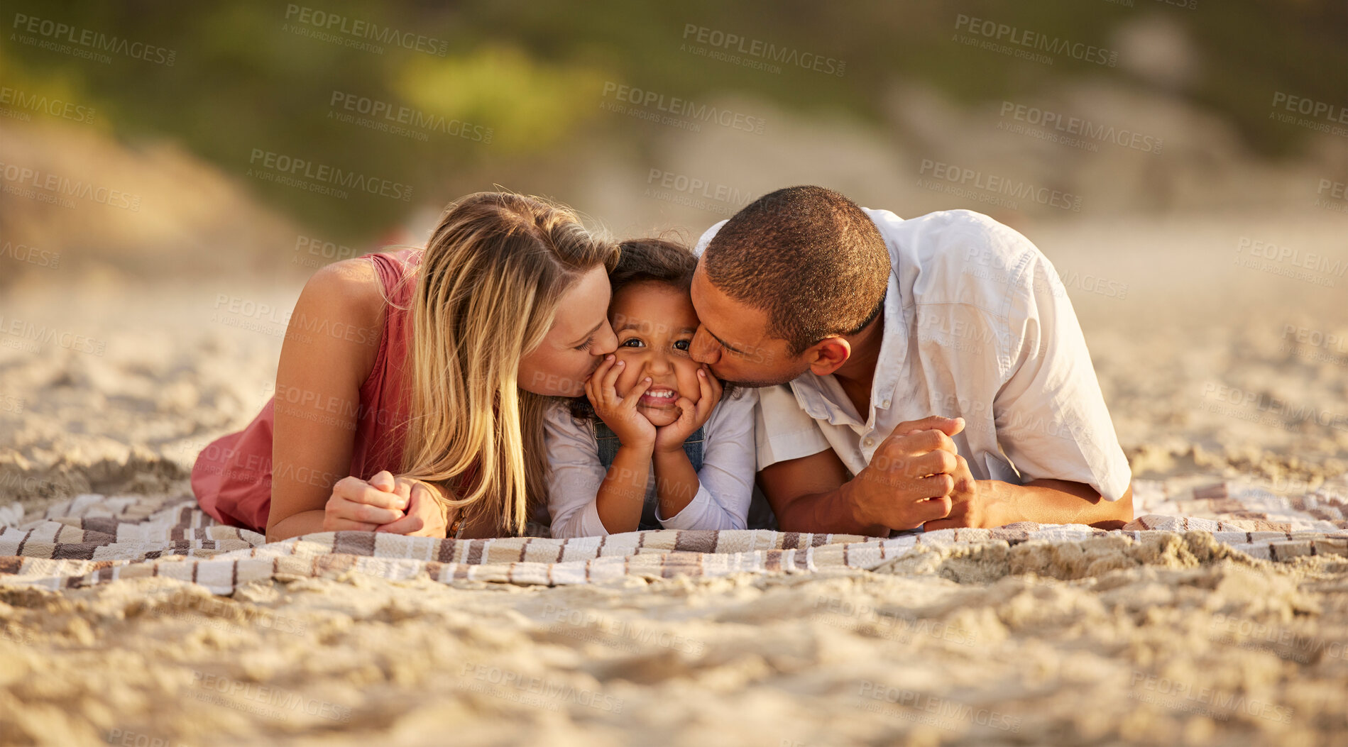 Buy stock photo Kiss, child and parents on beach as happy family for love, support and care on vacation or holiday. Woman, male person and interracial in bonding with kid, outdoor and together for affection or relax