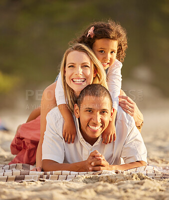 Buy stock photo Portrait, beach and family with love, stack and travel with adventure, getaway trip and bonding together. Face, happy parents and mother with father, interracial and girl on ground, ocean and seaside