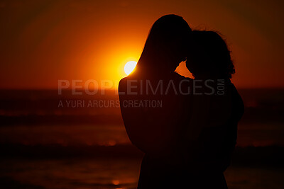 Buy stock photo Hug, beach and silhouette of couple at sunset for bonding holiday, love and tropical island travel. Nature, man and woman on romantic ocean date together with embrace, orange sky and outdoor vacation