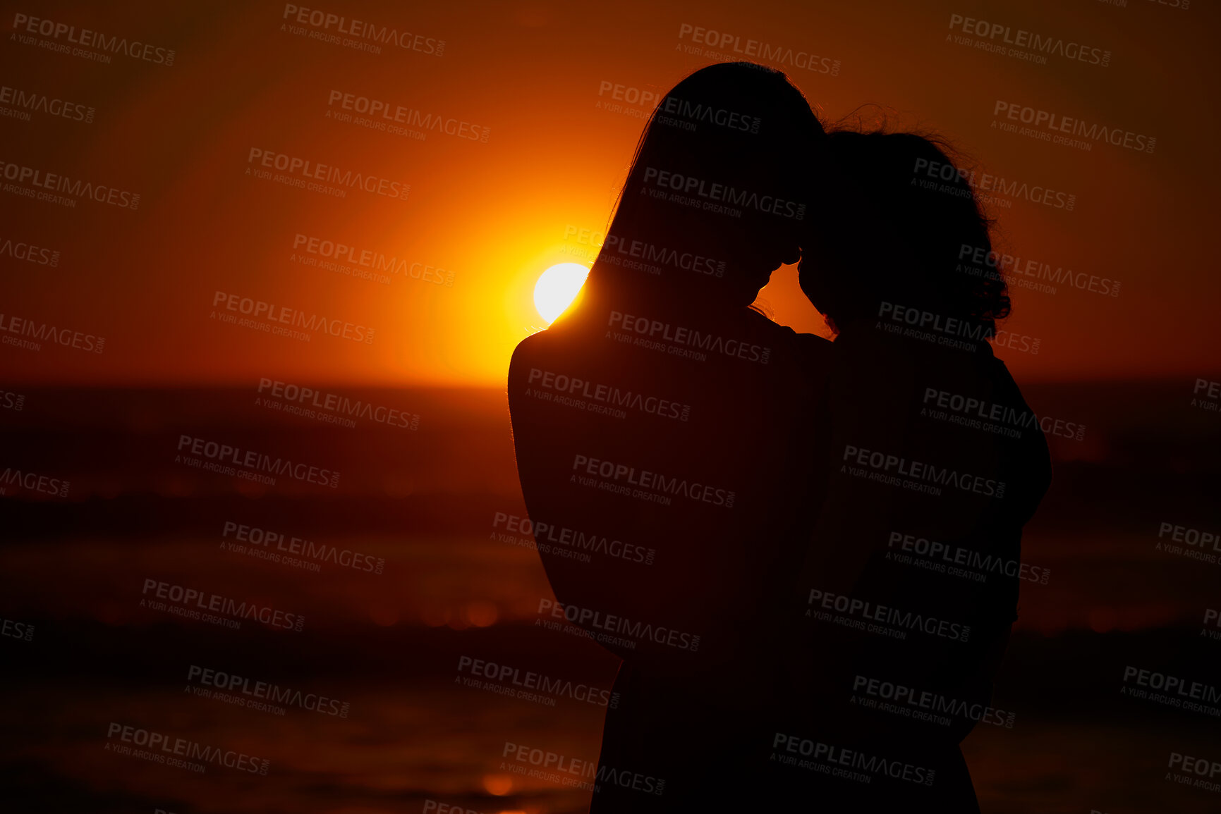 Buy stock photo Hug, beach and silhouette of couple at sunset for bonding holiday, love and tropical island travel. Nature, man and woman on romantic ocean date together with embrace, orange sky and outdoor vacation