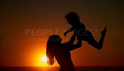 Buy stock photo Mom, kid and happy with lifting at beach for bonding on break, relax and fun in Spain. People, family and playful on silhouette at ocean on holiday with smile for child development, growth and care