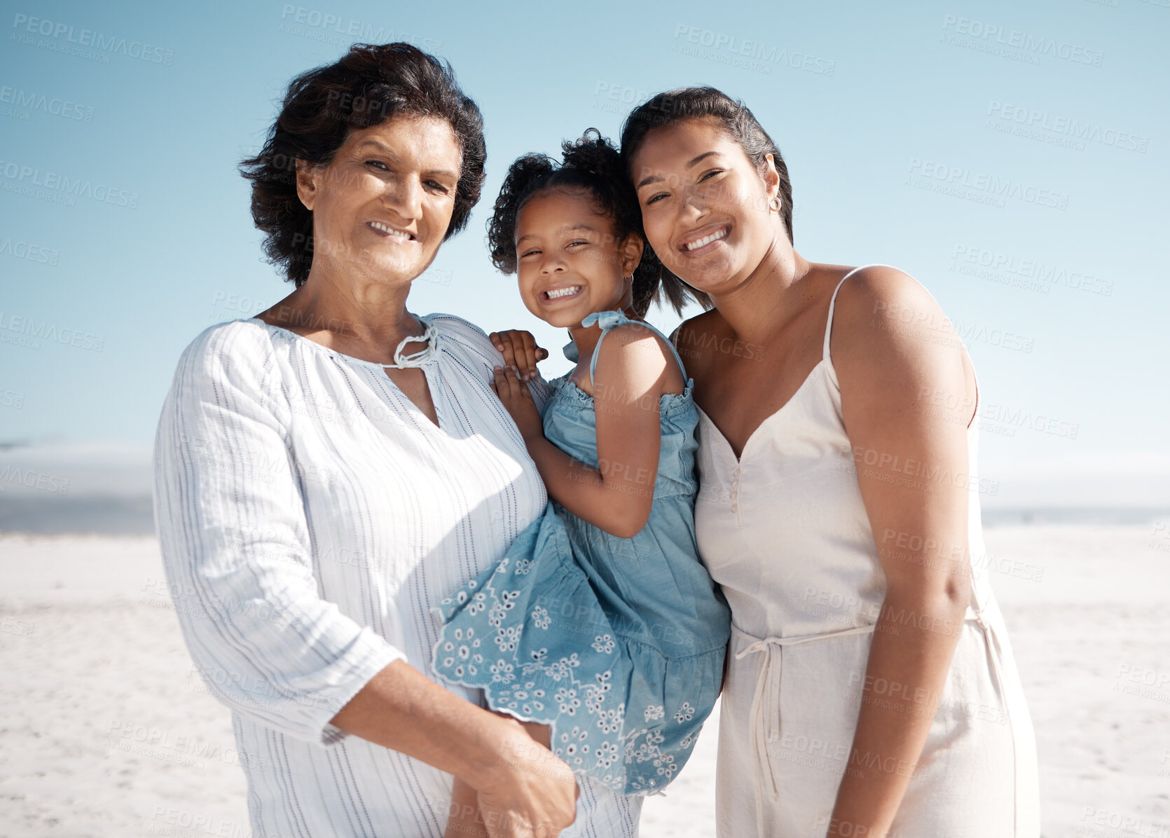 Buy stock photo Outdoor, portrait and old woman with family, beach and grandma with granddaughter, bonding and love. Happy, girl and mom on vacation, sea and relax in holiday, travel and smile of child in Portugal