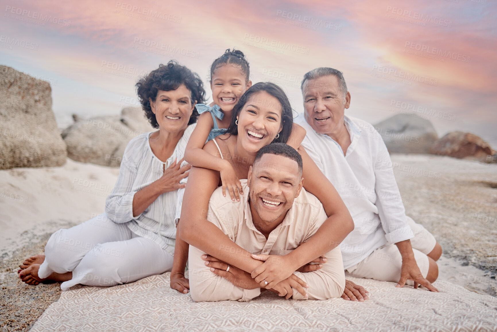 Buy stock photo Portrait, beach and family in pile, love and bonding together with vacation, travel and summer holiday. Face, grandparents and mother with father, girl and daughter with generations, stack or seaside