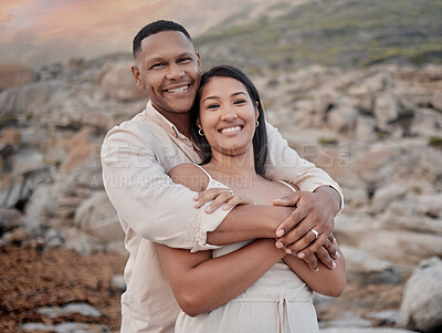 Buy stock photo Hug, love and portrait of couple on beach at sunset on romantic date for travel with vacation or weekend trip. Happy, bonding and young people embracing by ocean in evening on tropical holiday.