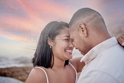 Buy stock photo Smile, connection and couple on beach at sunset on romantic date for travel with vacation or weekend trip. Love, commitment and young man and woman bonding by ocean in evening on tropical holiday.