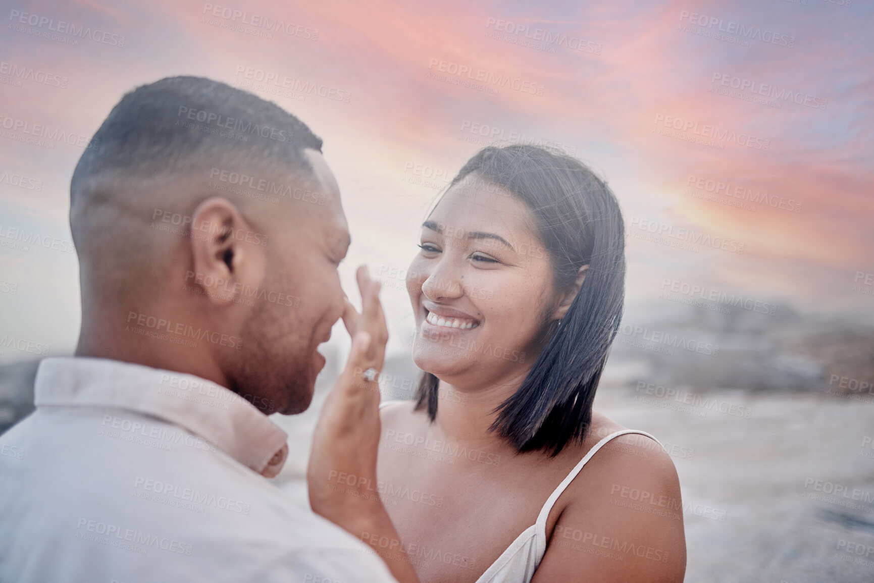 Buy stock photo Happy, marriage and couple on beach at sunset on romantic date for travel with vacation or weekend trip. Smile, bonding and young man and woman with connection by ocean in evening on tropical holiday