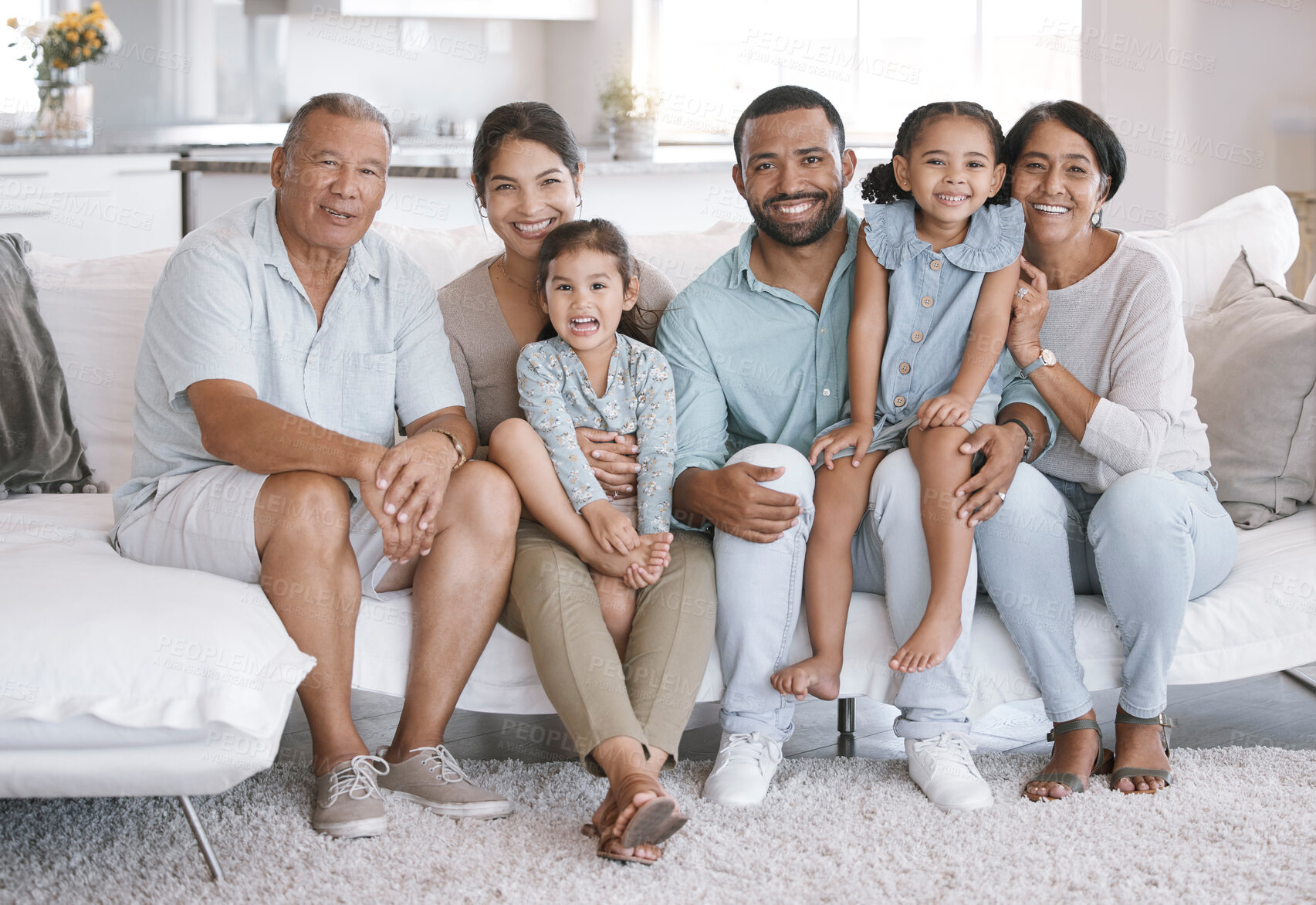 Buy stock photo Happy, love and portrait with big family on sofa in living room of home together for bonding or visit. Hug, relax or smile with senior people, parents and sibling children in apartment on weekend