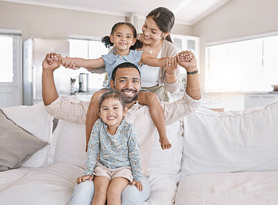 Buy stock photo Carry, portrait and smile with family on sofa in living room of home together for bonding or fun. Happy, relax or shoulders with mother, father and sibling girl children in apartment on weekend