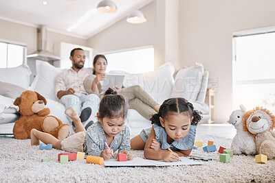 Buy stock photo Relax, parents and kids in home with toys, teddy bear and coloring book for development activity. Happy, portrait and girls on floor to play, learn and bonding together with mom and dad on sofa.