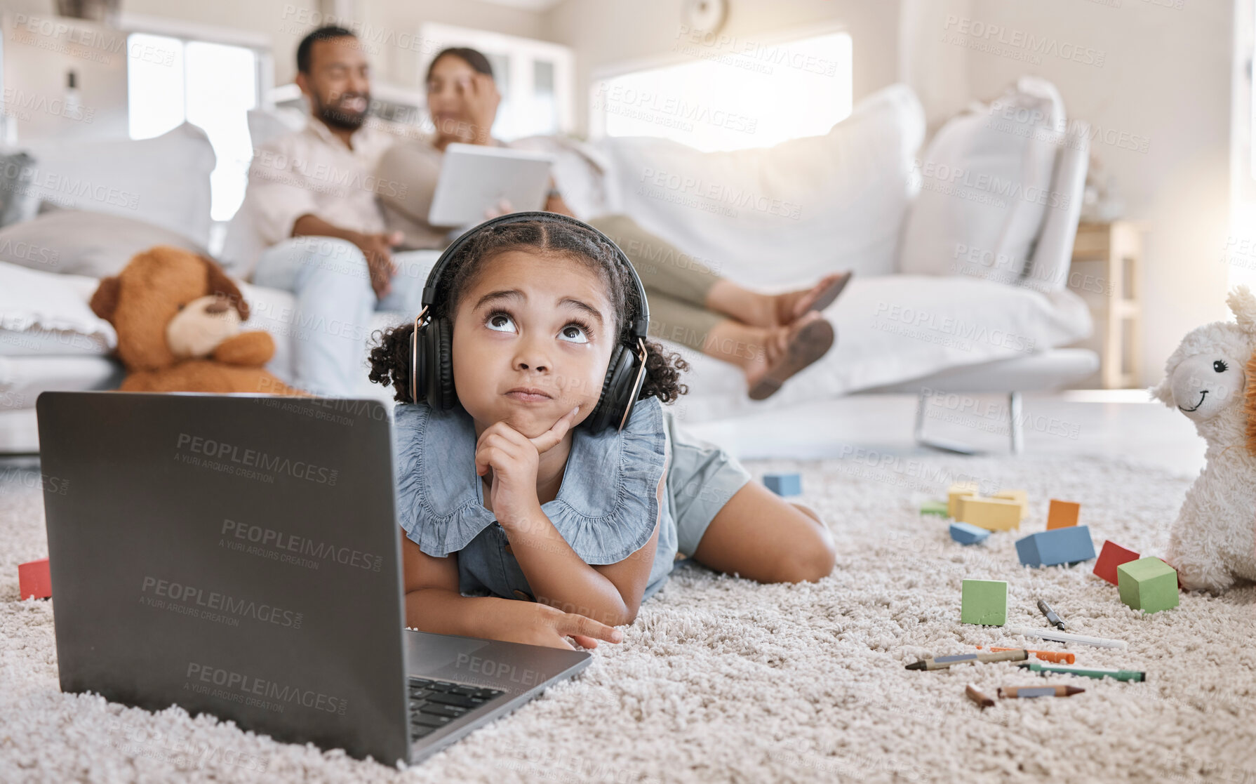 Buy stock photo Child, thinking and laptop with headphones for online, hobby or entertainment in home for e learning. Young person, kid and technology for youth development, growth or creativity as student in lounge