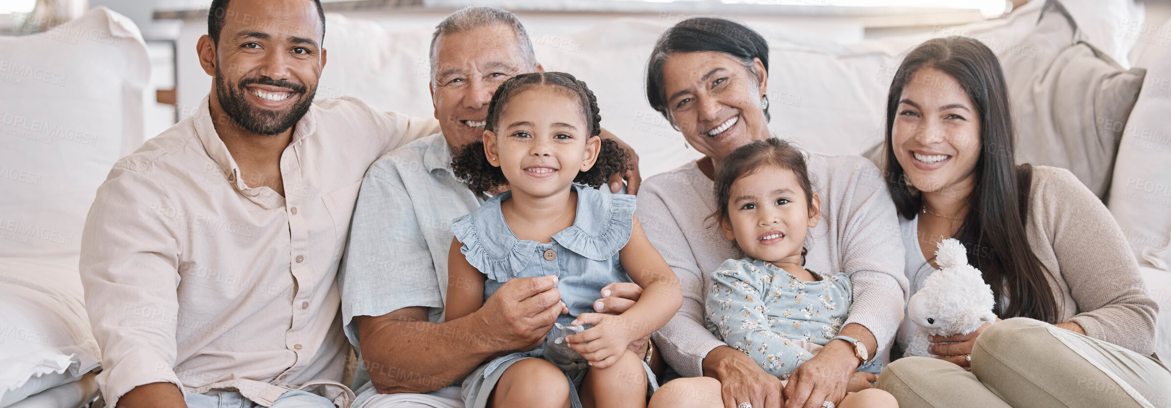 Buy stock photo Portrait, relax and smile with big family on sofa in living room of home together for bonding or visit. Happy, hug or love with senior grandparents, parents and children in apartment on weekend