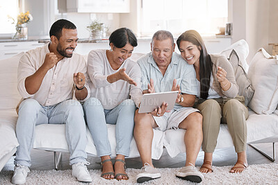 Buy stock photo Fist pump, smile and tablet with happy family on sofa in home living room together for streaming. Celebration, motivation and success with senior parents, man and woman sports fans in apartment