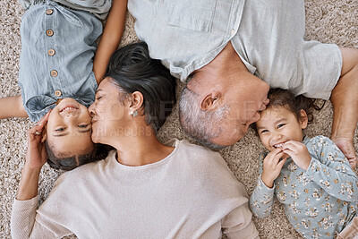 Buy stock photo Home, grandparents and kiss kids for love, care and people bonding together on floor above. Grandfather, grandmother and happy children relax in top view in lounge with family generations and sisters