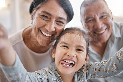 Buy stock photo Selfie, funny and portrait of kid with grandparents in home for memory, bonding or family time. Smile, love and face of girl child with grandmother and grandfather for photography picture in house.