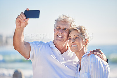 Buy stock photo Senior couple, smile and selfie at beach for outdoor summer vacation, travel and memory together. Happy, man and woman with digital photography by ocean for retirement, holiday or adventure in Cancun