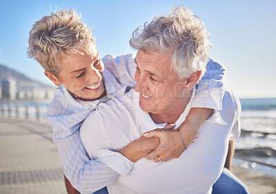 Buy stock photo Smile, piggyback and mature couple in beach, nature and bonding on vacation for fresh air and enjoy. Holiday, old man and woman for romance in Australia, travel and date by ocean, walking and weekend