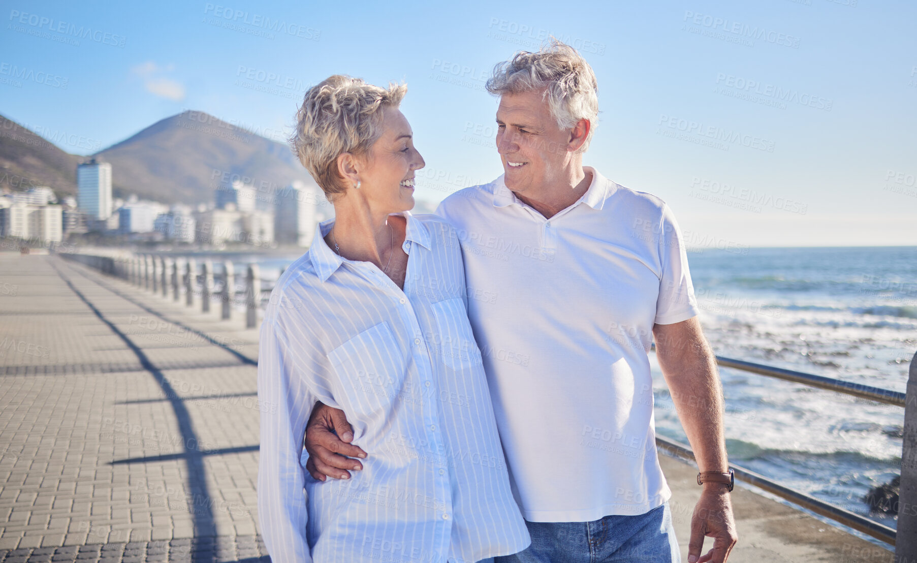 Buy stock photo Water, happy and mature couple in beach, hug and bonding in vacation for fresh air, smile and nature. Holiday, old man and woman for romance in Australia, travel and date in ocean, enjoy and weekend