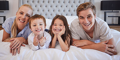 Buy stock photo Portrait, family and smile with love in bedroom for weekend, bonding and trust support of childhood memory. Happy, parents and kids with carefree, relax and care together for calm morning at house