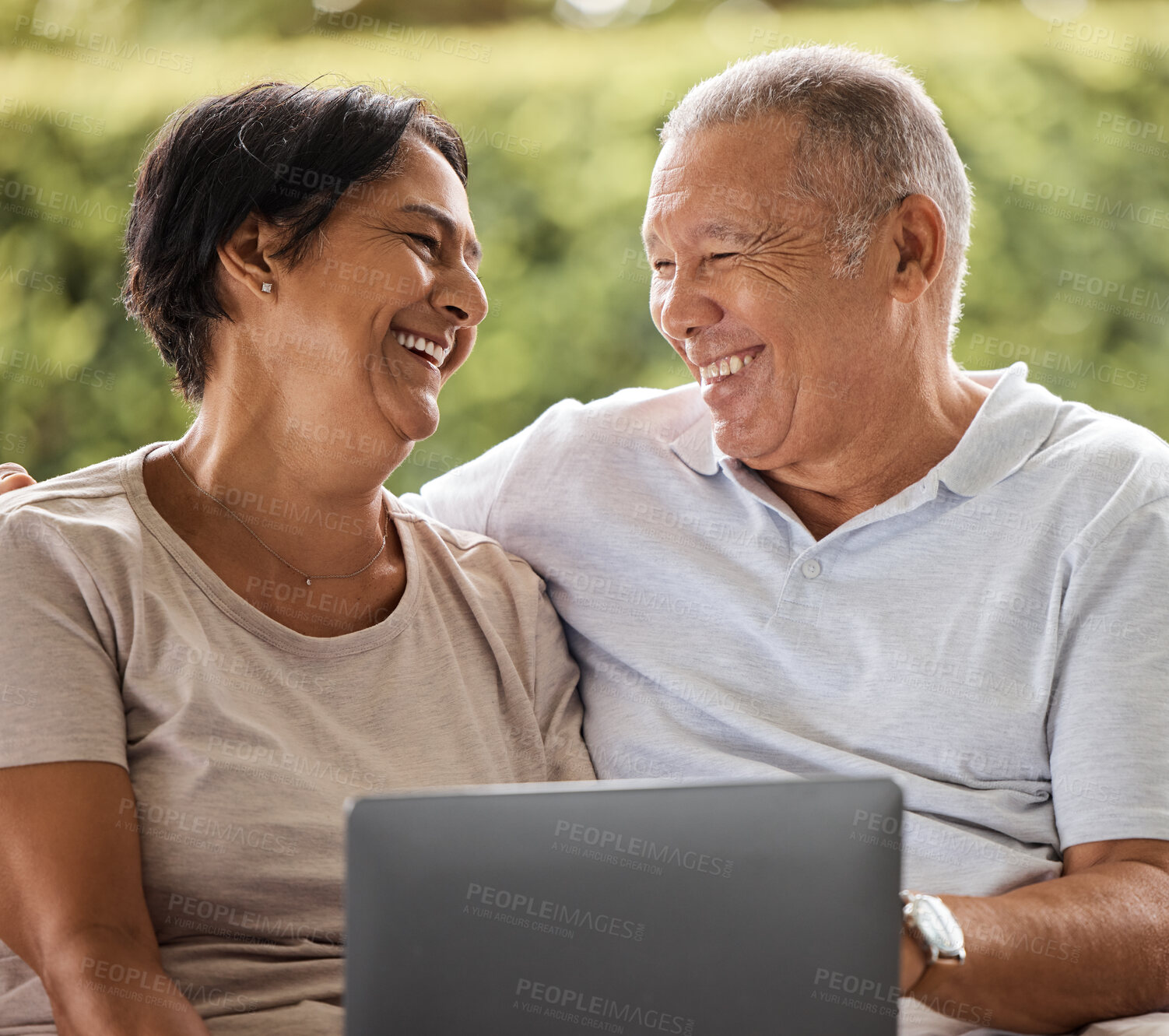 Buy stock photo Laptop, love and smile with senior couple in garden of home together for internet or social media browsing. Funny, happy or laughing with elderly man and woman outdoor at apartment for bonding