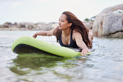 Buy stock photo Fitness, surfer woman surfing in ocean with surfboard, swimwear and peace with sport outdoor and nature. Beach, exercise and young female, surf on waves with adventure and extreme sports on holiday