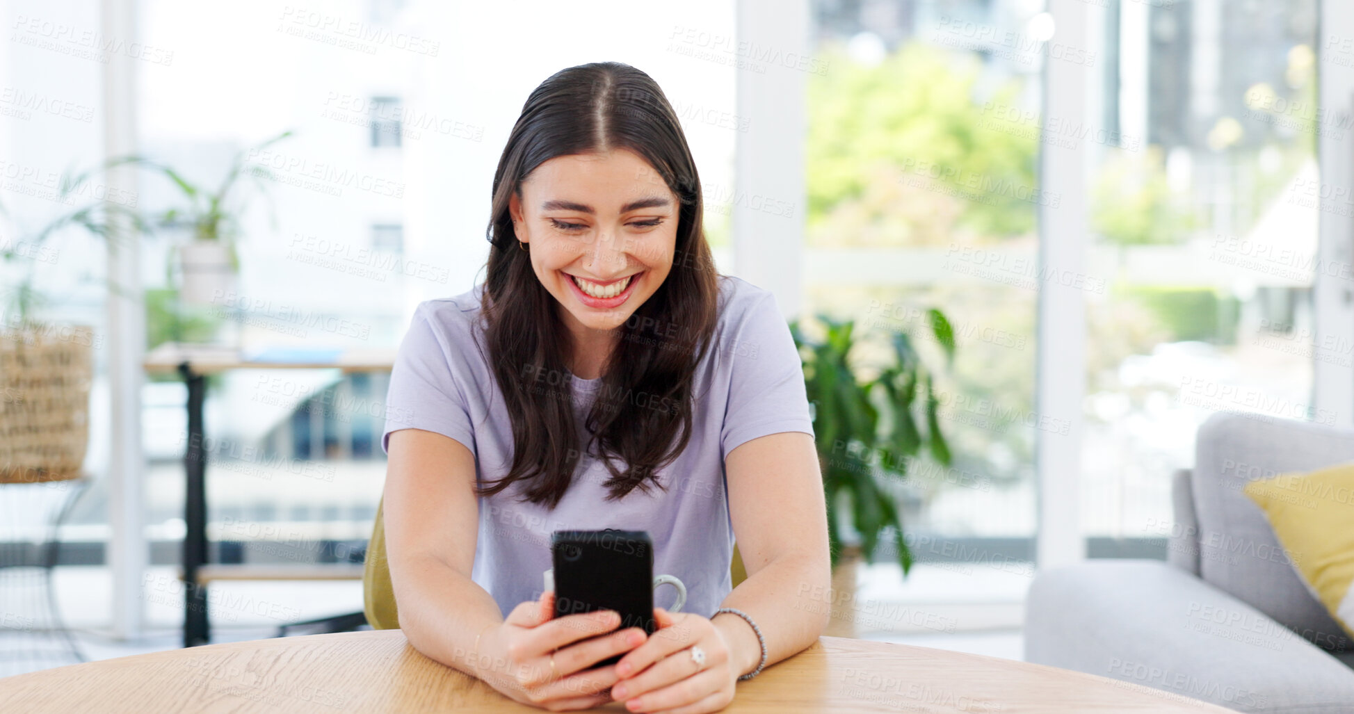 Buy stock photo Phone, smile and young woman in the living room networking on social media or mobile app. Happy, technology and female person from Canada scroll on the internet with cellphone in lounge at apartment.