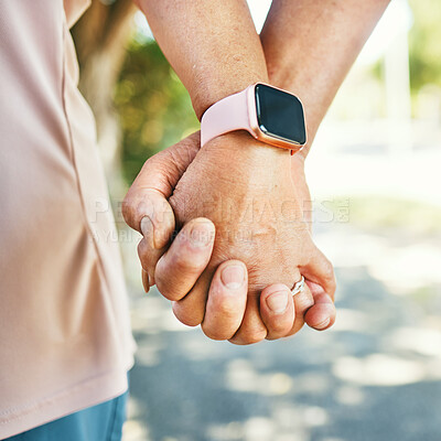 Buy stock photo Closeup, holding hands and support with trust for love in bond, together or romance while walking. Elderly couple, man and woman in retirement with exercise for wellness, health or smart watch