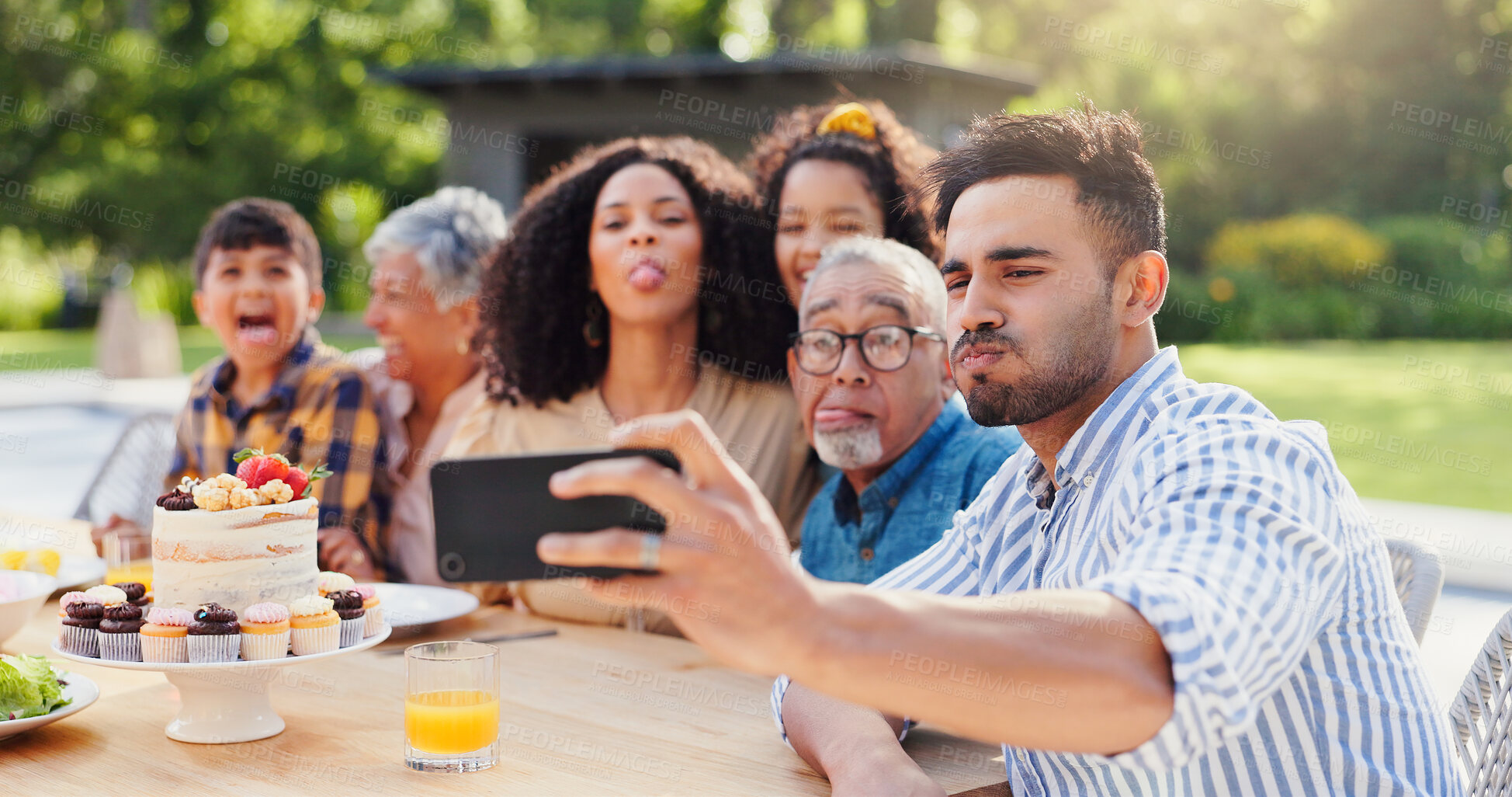 Buy stock photo Selfie, family and funny in backyard with birthday, social media and grandparents outdoor. Home, smile and table with celebration and party cake in garden with parents and kids with love and food