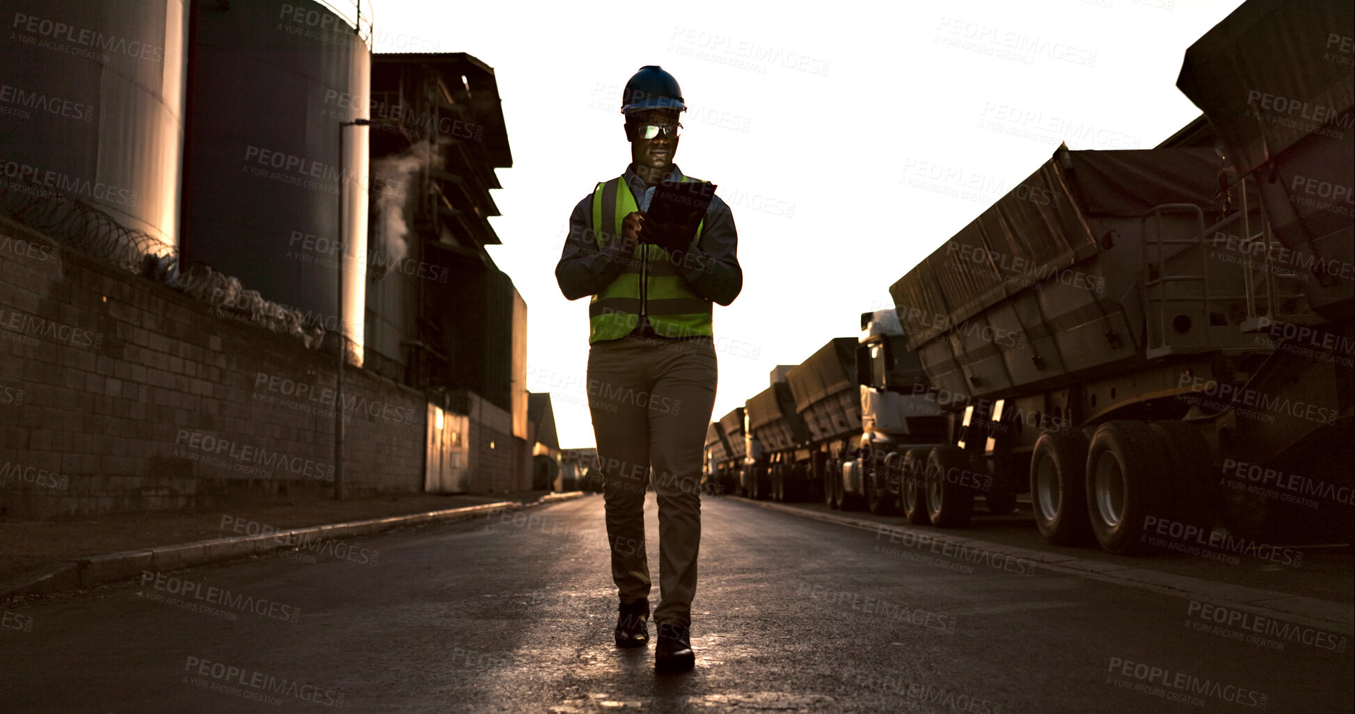 Buy stock photo Construction worker, man and walking with tablet on site in morning for vehicle inspection for logistics or cargo export. Shipping industry, inspector or employee with digital app for quality control