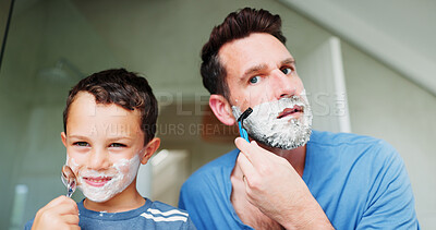 Buy stock photo Shaving cream, bathroom and dad with boy for skincare, happy and playful practice for growth or development. Father, family and together in home for learning facial, grooming and bonding with love.