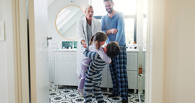 Buy stock photo Parents, children and embrace with love in bathroom by holding hands, bonding together and morning routine. Smile, family and kids with hug for development support, trust and care at house