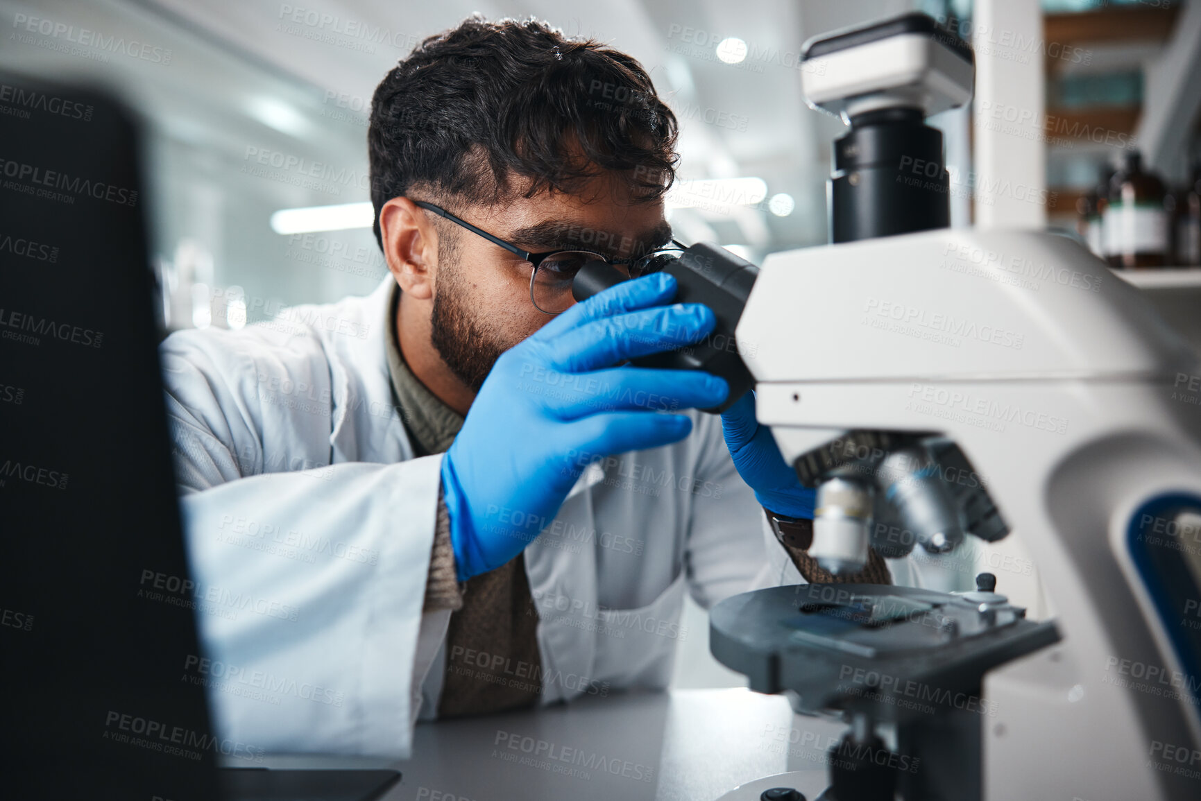 Buy stock photo Man, scientist and microscope for healthcare in lab of experiment research, medical data and studying bacteria. Person, researcher and biotechnology for pharmaceutical development of vaccine solution