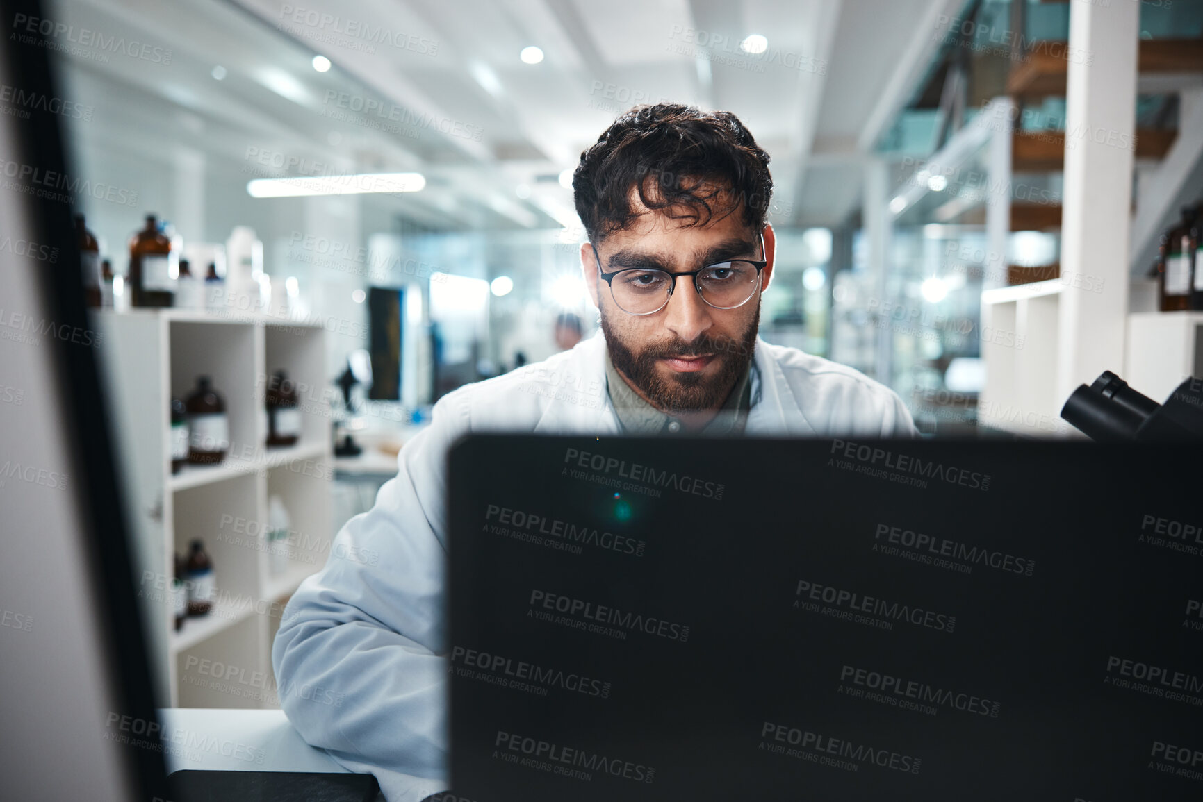 Buy stock photo Science, man and reading in laboratory on computer for medical results, investigation and pharmaceutical research. Male scientist, online and innovation for clinical study, review and development.