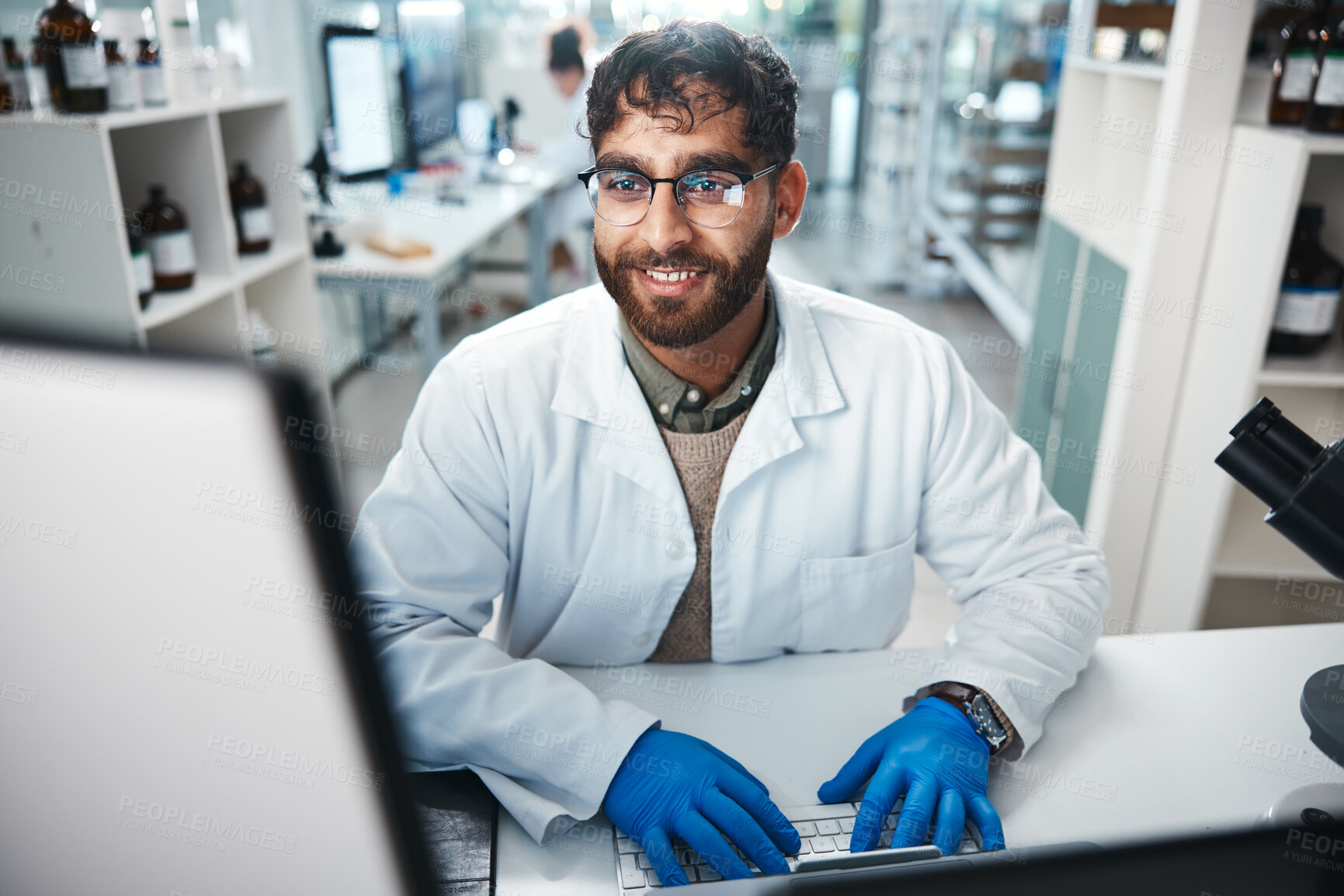 Buy stock photo Laptop, science and smile with man in laboratory for development, innovation or research. Computer, pharmaceuticals and report with happy scientist at work on medical breakthrough or discovery