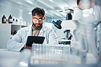 Man, scientist and healthcare with tablet in lab for microscope research, medical data and science information. Person, researcher and digital for study feedback, vaccine solution and biotechnology