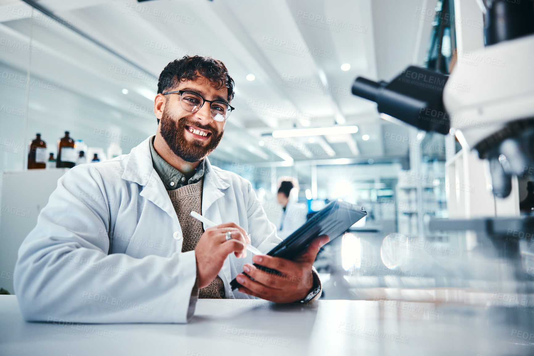 Buy stock photo Man, scientist and portrait on tablet in lab for microscope research, medical data and science information. Person, researcher and digital for study feedback, vaccine solution and biotechnology cure