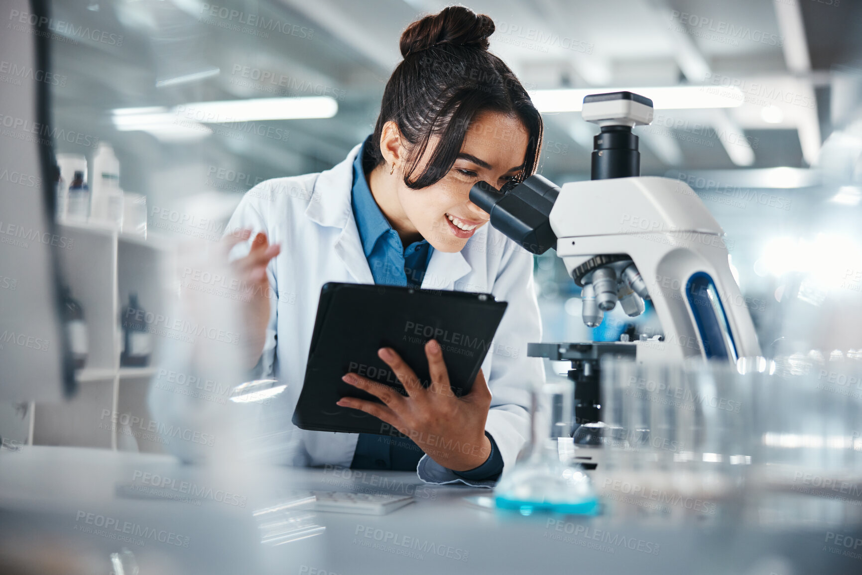 Buy stock photo Woman, scientist and microscope with tablet in lab for experiment research, medical data and science information. Smile, researcher and digital for biotechnology study, feedback and vaccine solution