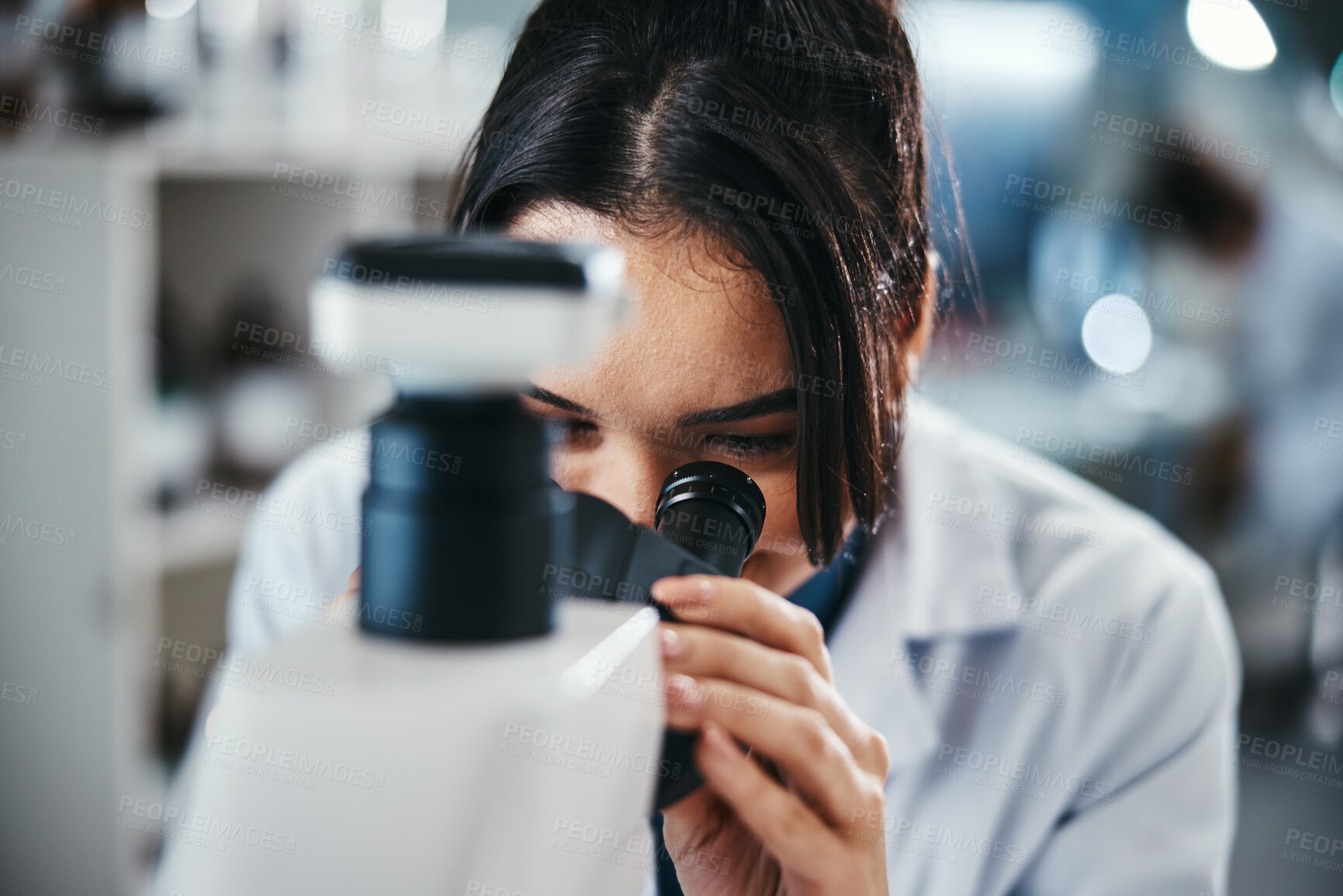 Buy stock photo Scientist, microscope and woman for healthcare in lab of experiment research, medical data or study bacteria. Smile, researcher and biotechnology for pharmaceutical development of vaccine production
